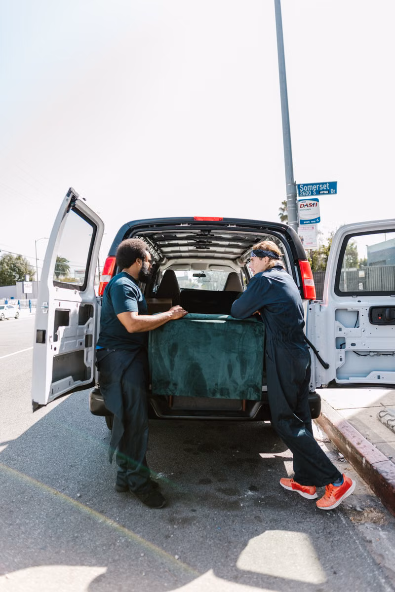 LayerUp junk removal crew loading unwanted items into a truck in Boise